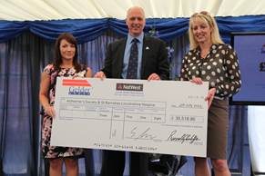 Presentation of a cheque for over £30,000